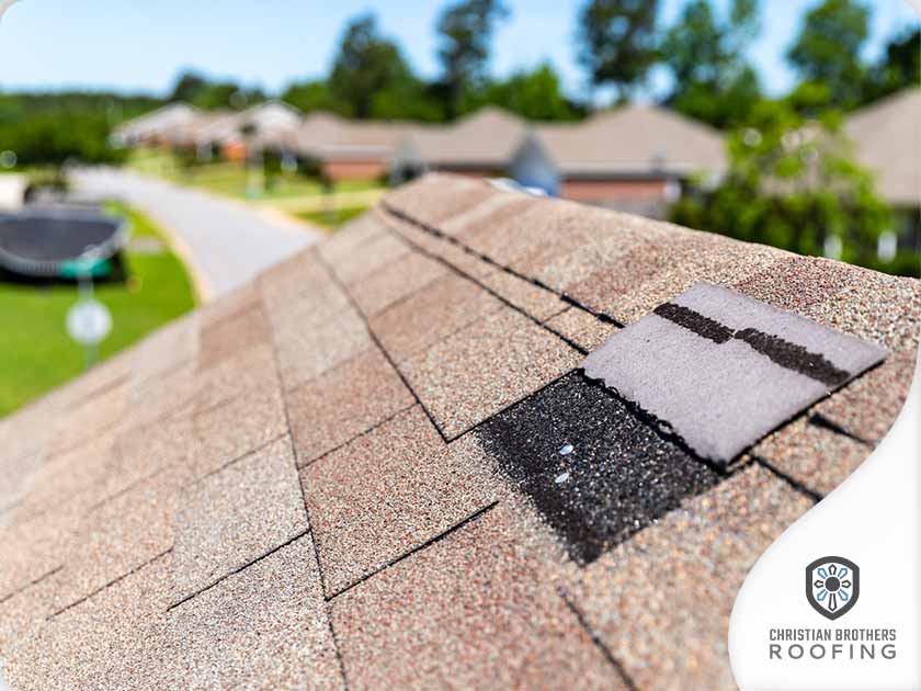 4371-1630568645-Wind-damaged-roof-that-needs-to-be-inspected-by-a-roofing-company.jpg